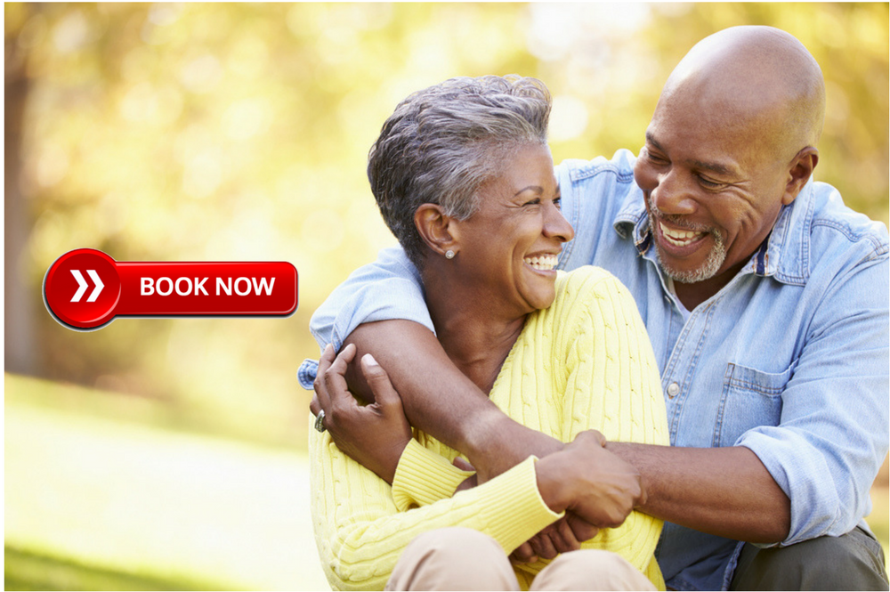 Senior African American Couple embracing and smiling